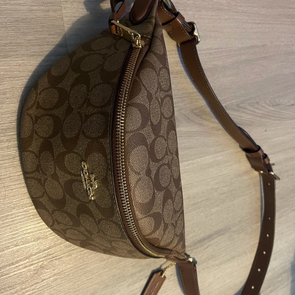 Coach bumbag. Brown signature logo with leather strap.